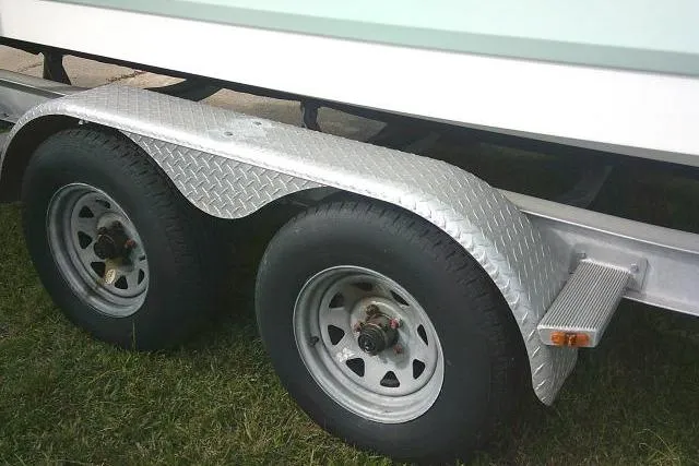 Slide: The Image of Trailer wheels and fender of a 2016 Robalo R200 Center Console boat. - 7