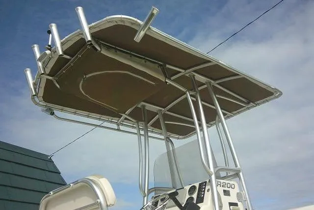 Slide: The Image of 2016 Robalo R200 Center Console boat with T-top and rod holders. - 9