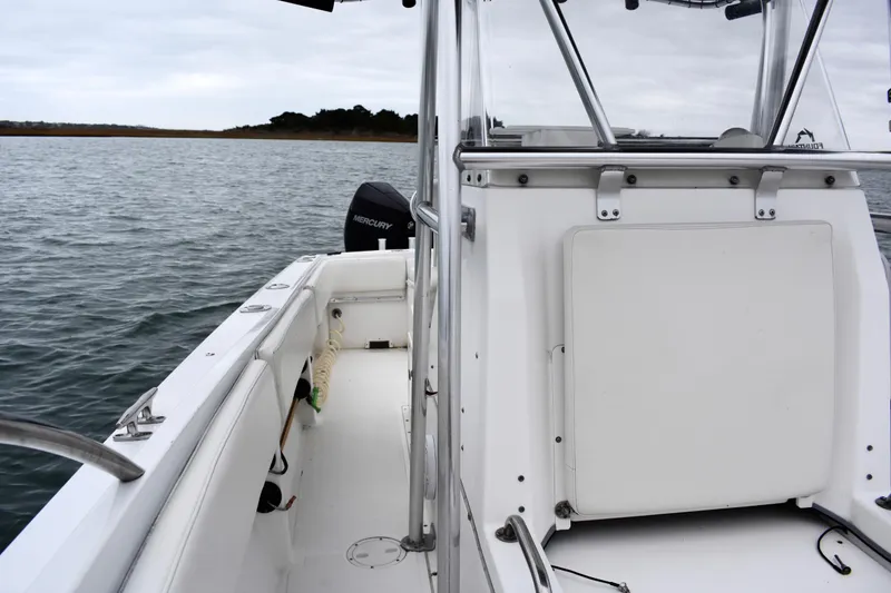 Slide: The Image of 2001 Fountain 31 Tournament Edition boat on calm water, featuring Mercury engine. - 14