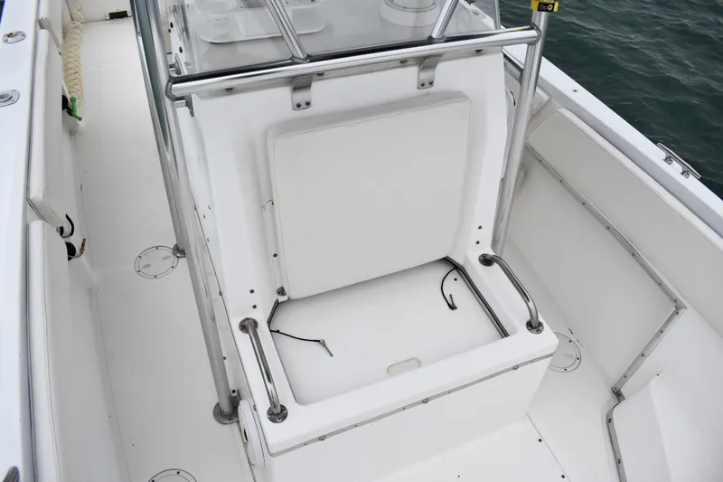 Slide: The Image of 2001 Fountain 31 Tournament Edition boat interior with seating and storage. - 17