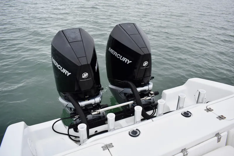 Slide: The Image of Twin Mercury outboard engines on a 2001 Fountain 31 Tournament Edition boat. - 27