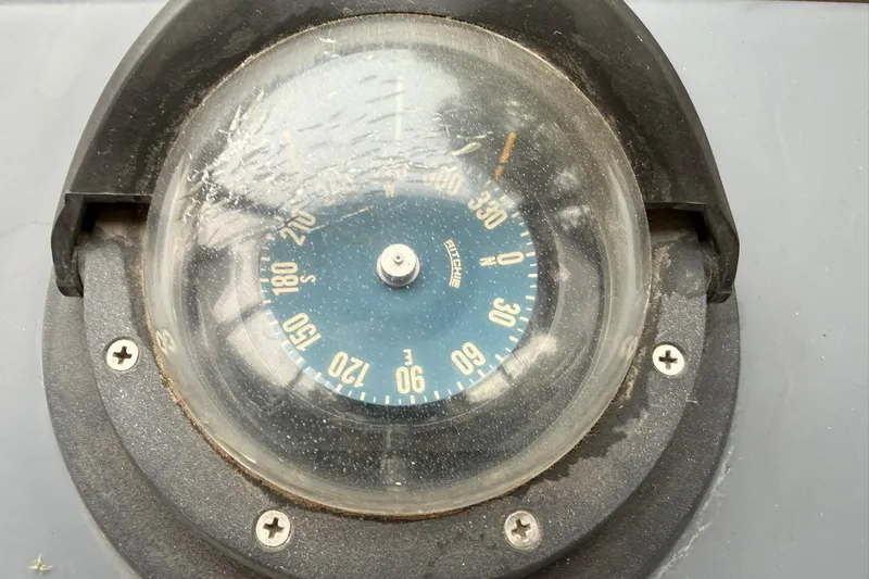 Slide: The Image of Compass on 1991 Bayliner 4387 Motoryacht dashboard, showing directional degrees. - 10
