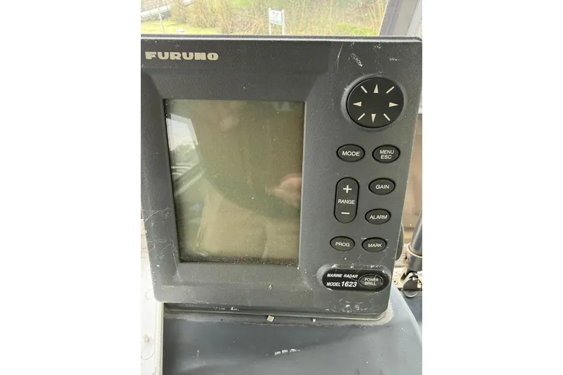 Slide: The Image of Furuno marine radar display on 1991 Bayliner 4387 Motoryacht dashboard. - 11