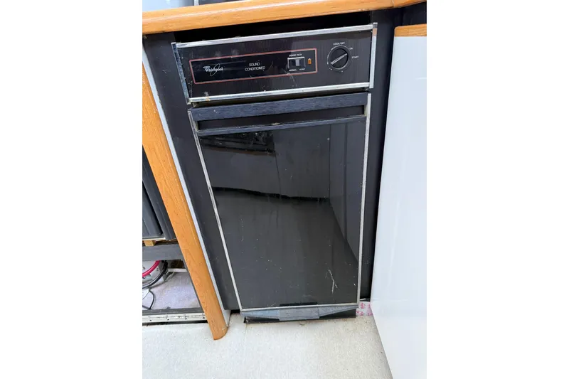 Slide: The Image of Whirlpool dishwasher in 1991 Bayliner 4387 Motoryacht kitchen area. - 20