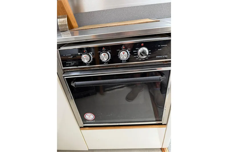 Slide: The Image of Princess stove and oven in a 1991 Bayliner 4387 Motoryacht kitchen. - 21