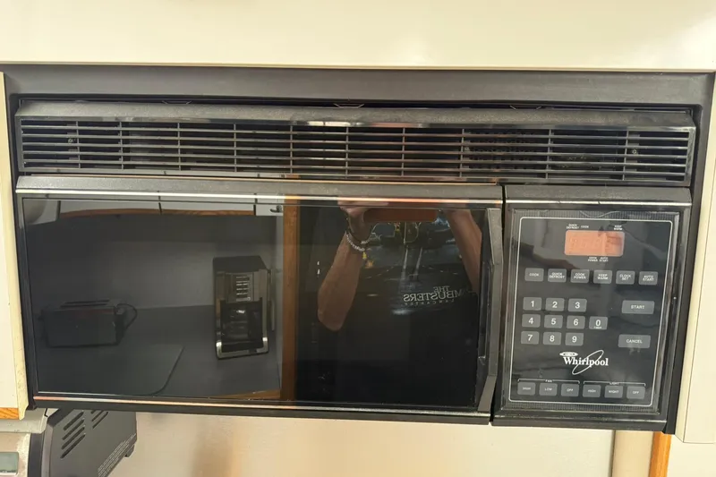 Slide: The Image of Whirlpool microwave in a 1991 Bayliner 4387 Motoryacht kitchen setup. - 22