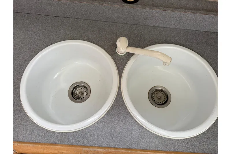Slide: The Image of Dual sinks with faucet in 1991 Bayliner 4387 Motoryacht kitchen area. - 25