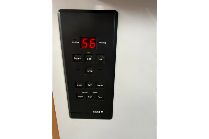 Slide: The Image of Control panel of a 1991 Bayliner 4387 Motoryacht, displaying temperature settings. - 28