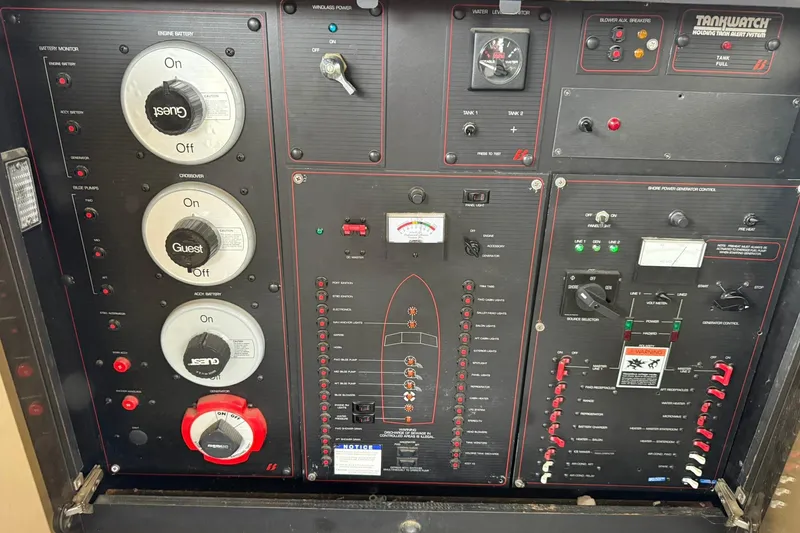 Slide: The Image of Control panel of a 1991 Bayliner 4387 Motoryacht with various switches and gauges. - 31
