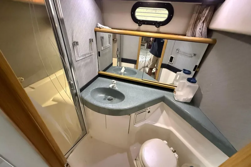 Slide: The Image of Bathroom interior of 1991 Bayliner 4387 Motoryacht with sink, mirror, and toilet. - 35