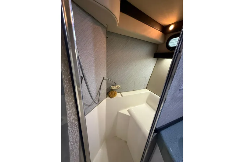 Slide: The Image of Shower area inside 1991 Bayliner 4387 Motoryacht, featuring modern fixtures and lighting. - 36