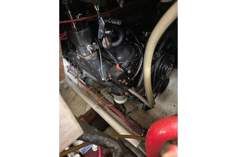 Slide: The Image of Engine compartment of a 1991 Bayliner 4387 Motoryacht, showcasing mechanical components. - 42