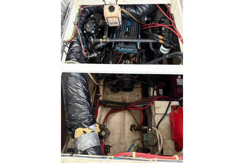 Slide: The Image of Engine compartment of 1991 Bayliner 4387 Motoryacht with visible wiring and components. - 47