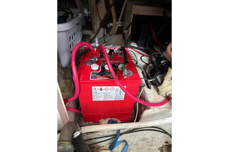 Slide: The Image of Red battery in the engine compartment of a 1991 Bayliner 4387 Motoryacht. - 49