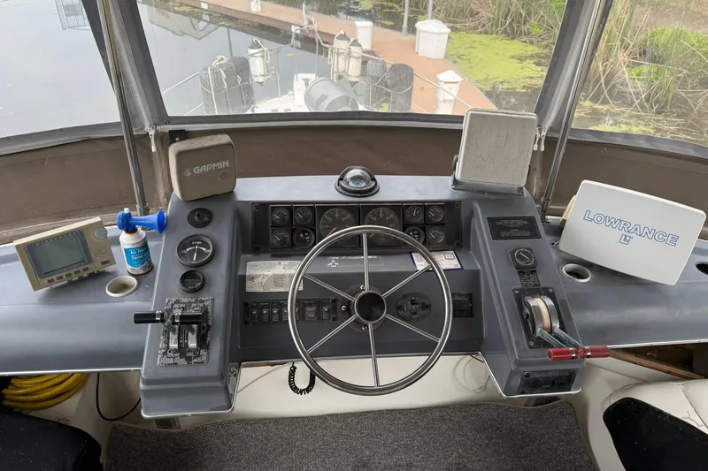 Slide: The Image of 1991 Bayliner 4387 Motoryacht helm with Garmin and Lowrance navigation systems. - 7