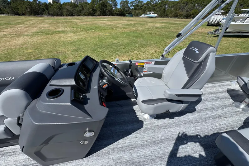 Slide: The Image of 2026 Bennington 22 S Fish boat interior with steering console and captain's chair. - 17