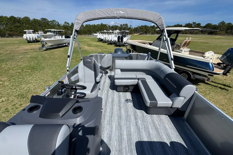 Slide: The Image of 2026 Bennington 22 S Fish pontoon boat with spacious seating and modern design on display. - 18