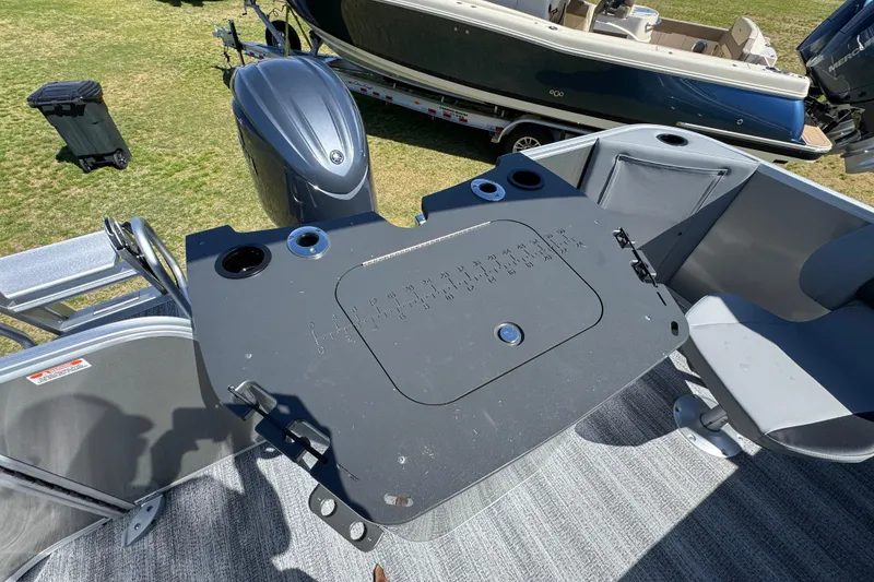 Slide: The Image of 2026 Bennington 22 S Fish boat deck with motor and seating area. - 23