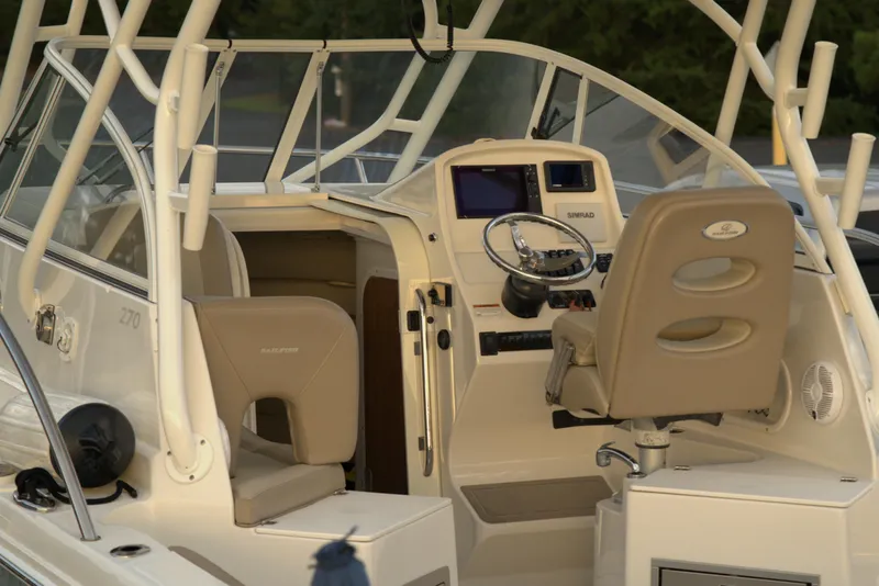 Slide: The Image of 2020 Sailfish 270 WAC boat interior with steering wheel and dashboard. - 10