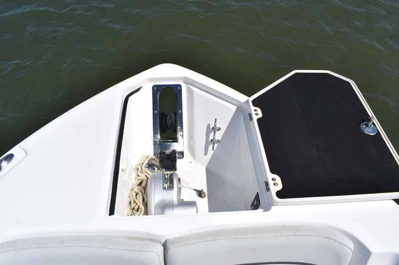 Slide: The Image of 2021 Sea Fox 268 Commander anchor compartment with rope and winch, open hatch. - 19