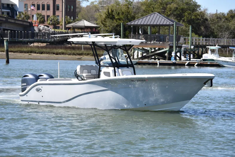The Image of 2021 Sea Fox 268 Commander boat cruising on a scenic waterway near a dock. - 2