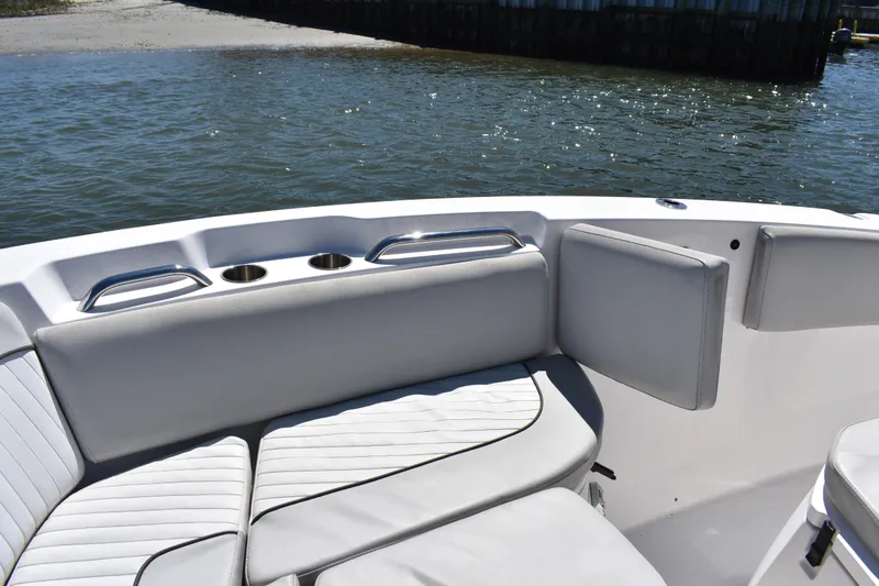 Slide: The Image of 2021 Sea Fox 268 Commander boat interior with cushioned seating and cup holders. - 22