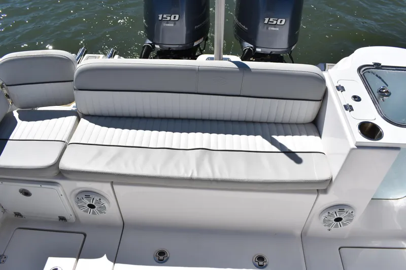 Slide: The Image of 2021 Sea Fox 268 Commander boat seating with dual Yamaha 150 engines in the background. - 51