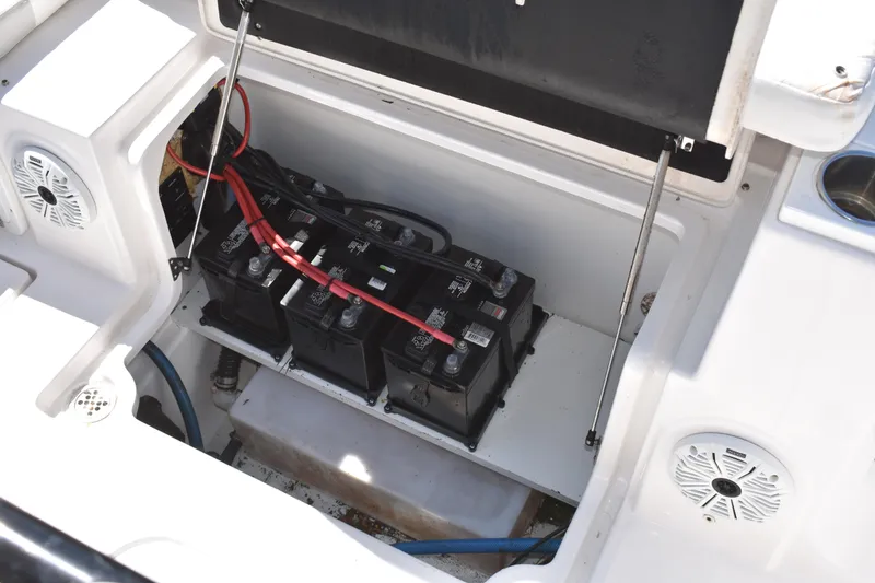 Slide: The Image of 2021 Sea Fox 268 Commander boat battery compartment with multiple batteries and wiring. - 52