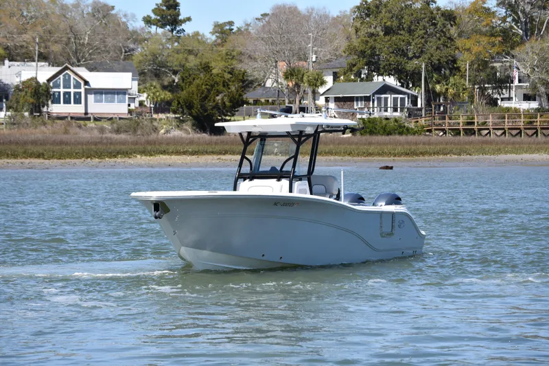 Slide: The Image of 2021 Sea Fox 268 Commander boat cruising on a calm river near residential area. - 8