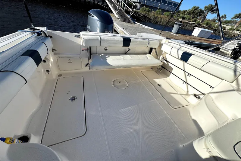 Slide: The Image of 2014 Wellcraft 252 Coastal boat interior with seating and Yamaha 300 engine. - 21