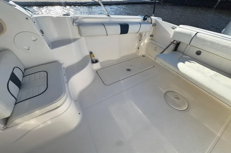 Slide: The Image of 2014 Wellcraft 252 Coastal boat interior with seating and storage compartments. - 23