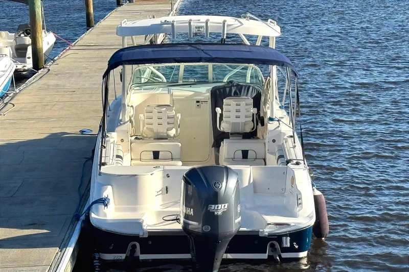 Slide: The Image of 2014 Wellcraft 252 Coastal boat docked, featuring Yamaha 300 outboard motor. - 3