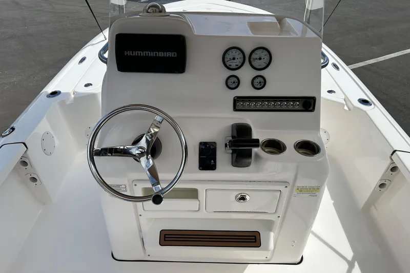 Slide: The Image of 2020 Tidewater 2110 Bay Max boat console with steering wheel and gauges. - 10