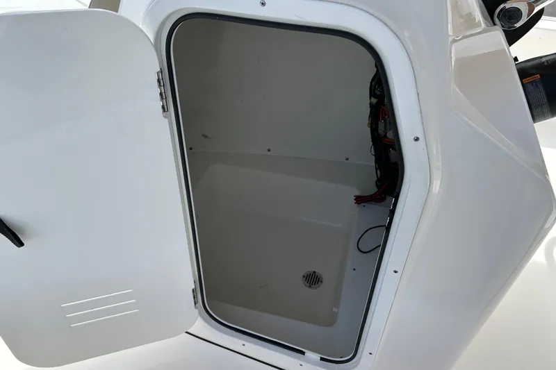 Slide: The Image of Open storage compartment on a 2020 Tidewater 2110 Bay Max boat. - 14