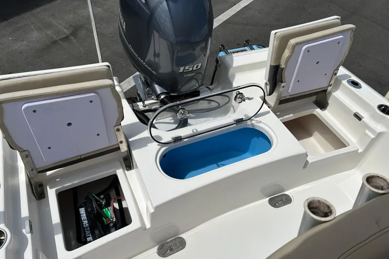 Slide: The Image of 2020 Tidewater 2110 Bay Max boat with Yamaha 150 engine and storage compartments. - 15