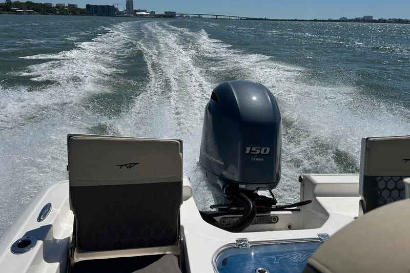 Slide: The Image of Tidewater 2110 Bay Max 2020 boat cruising with Yamaha 150 engine on open water. - 19
