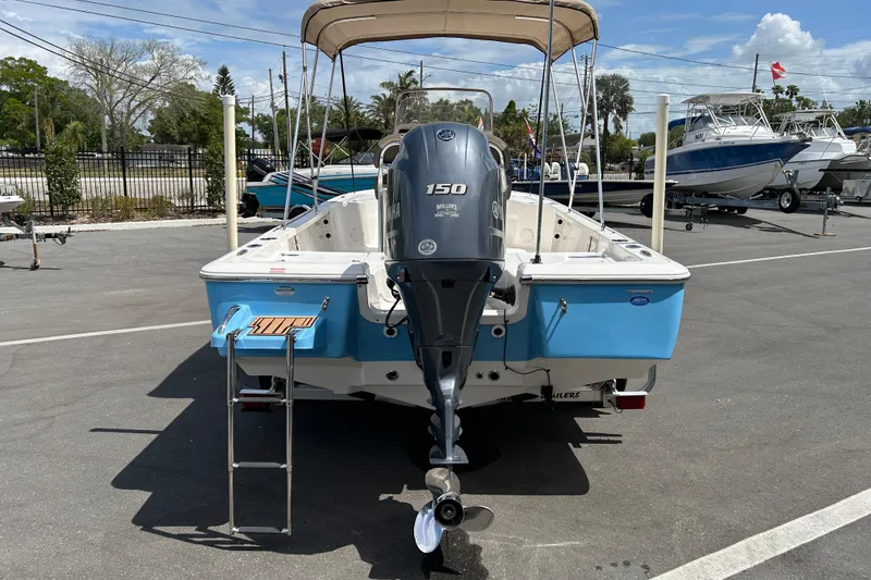 Slide: The Image of 2020 Tidewater 2110 Bay Max boat with Yamaha 150 engine, parked outdoors. - 3