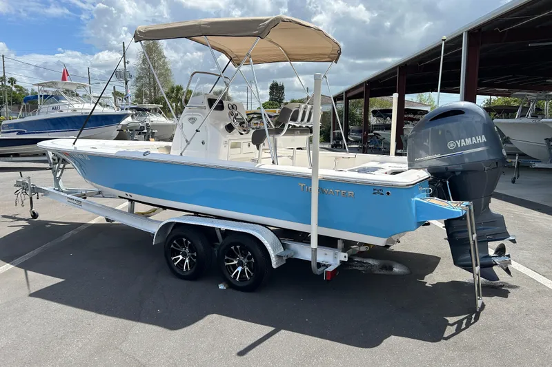 Slide: The Image of 2020 Tidewater 2110 Bay Max boat with Yamaha engine on trailer, parked outdoors. - 4