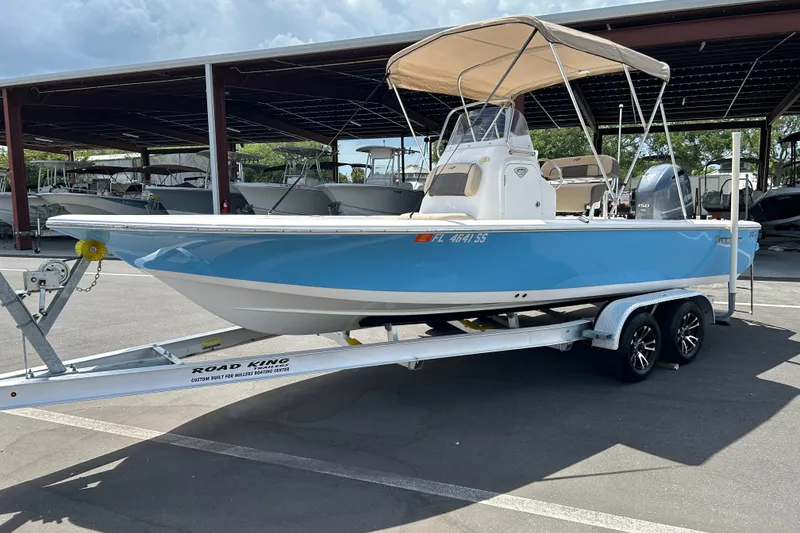 Slide: The Image of 2020 Tidewater 2110 Bay Max boat on trailer, parked under a canopy. - 5
