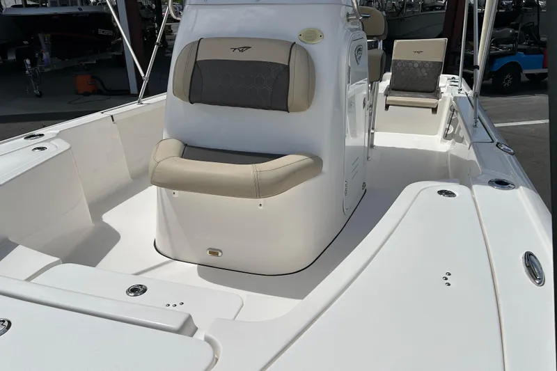 Slide: The Image of 2020 Tidewater 2110 Bay Max boat interior with seating and console, showcasing spacious design. - 9