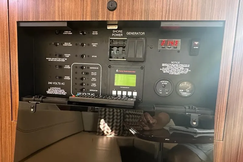 Slide: The Image of Electrical control panel of 2020 Pursuit OS 355 Offshore boat, featuring various switches and gauges. - 21