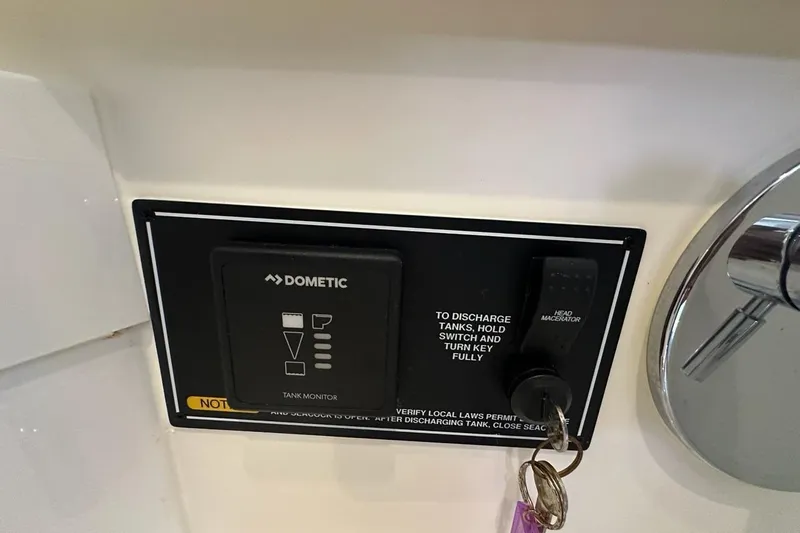 Slide: The Image of Control panel of a 2020 Pursuit OS 355 Offshore boat with Dometic tank monitor. - 34