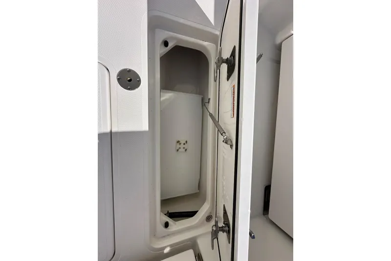 Slide: The Image of Open storage compartment on 2020 Pursuit OS 355 Offshore boat. - 42