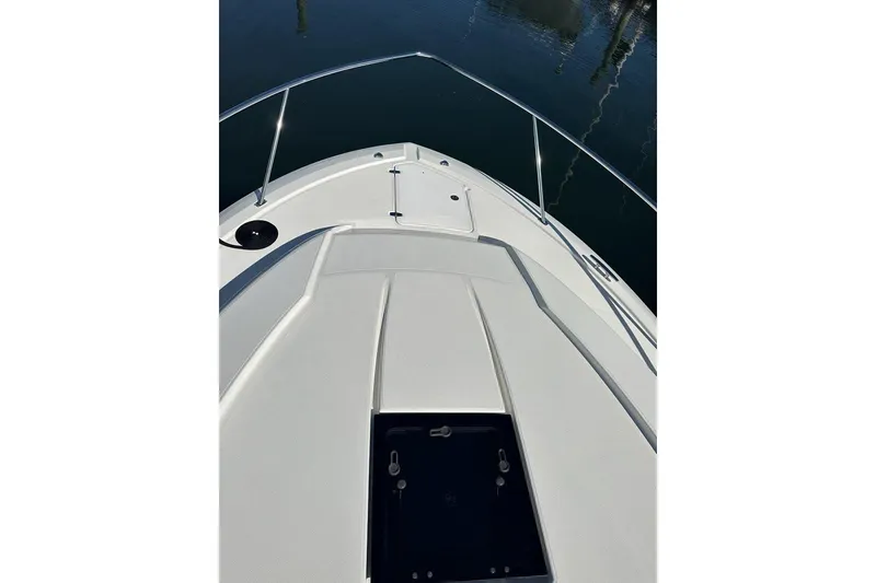 Slide: The Image of 2020 Pursuit OS 355 Offshore boat deck with sleek design and stainless steel railings. - 52