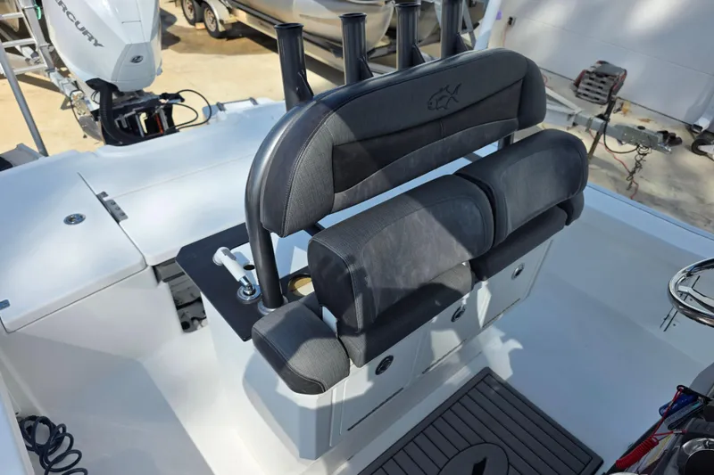 Slide: The Image of 2021 Crevalle 24 HCO boat interior with seating and fishing rod holders. - 19