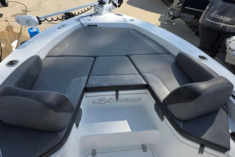 Slide: The Image of 2021 Crevalle 24 HCO boat interior with cushioned seating and Yamaha motor. - 22