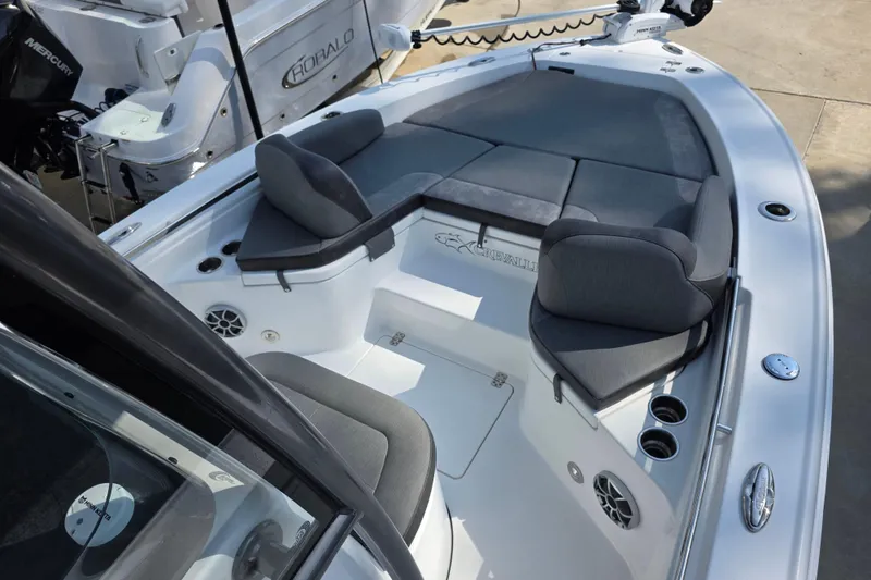 Slide: The Image of 2021 Crevalle 24 HCO boat interior with cushioned seating and modern design. - 27