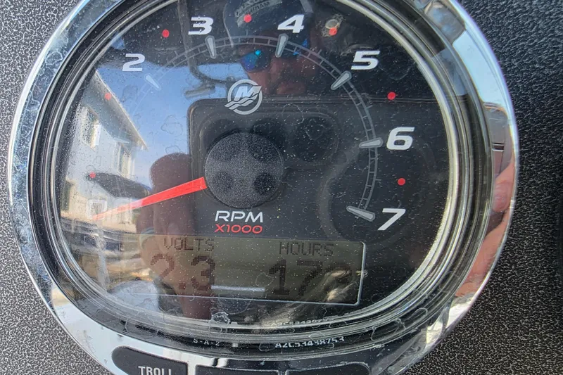 Slide: The Image of Close-up of a 2021 Crevalle 24 HCO tachometer displaying RPM and voltage. - 28