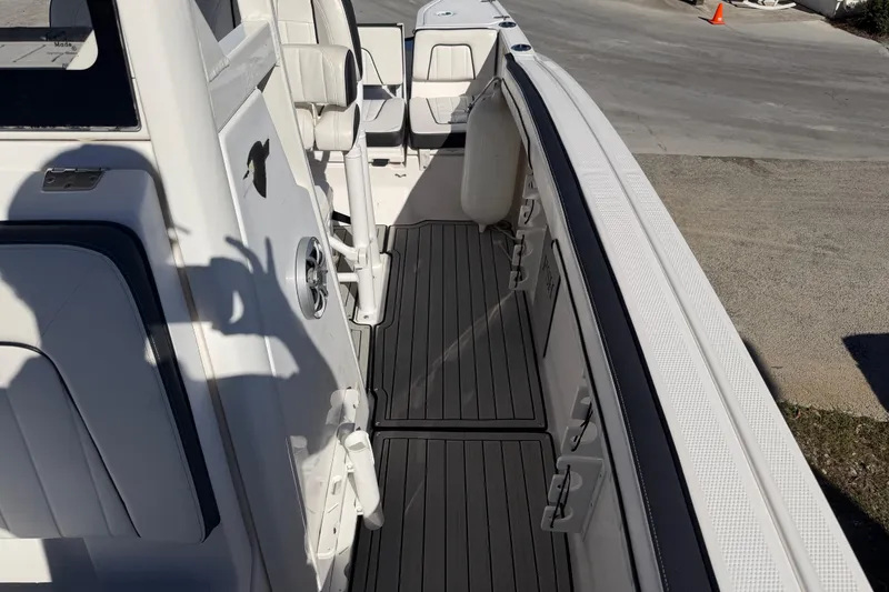 Slide: The Image of 2022 Yamaha Boats 252 FSH Sport interior with seating and deck details. - 17