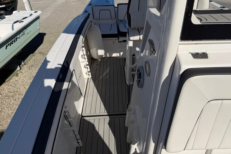 Slide: The Image of 2022 Yamaha Boats 252 FSH Sport interior with sleek seating and modern design. - 18